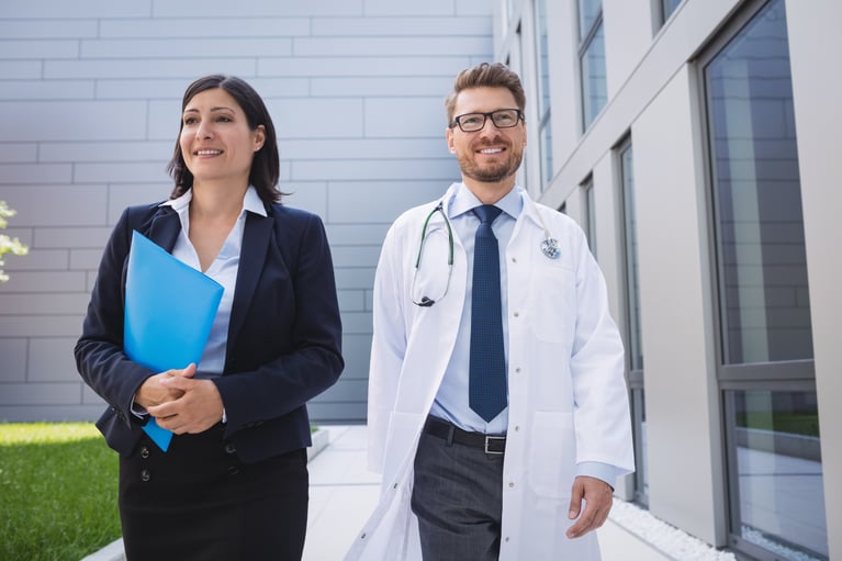 doctors-walking-together-hospital-premises